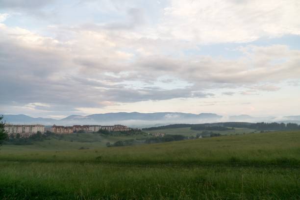 istock Sunrise and sunset over the hills and town. 1018416290