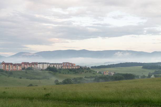 istock Sunrise and sunset over the hills and town. 1018416336