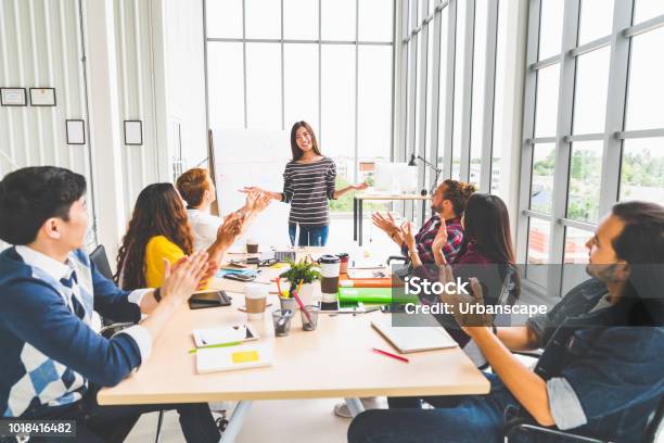 Multiethnic Diverse Group Of Creative Team Or Business Coworker Clapping Hands In Project Presentation Meeting Leading By Asian Woman Success Teamwork Modern Office Work Or Startup Company Concept Stock Photo - Download Image Now