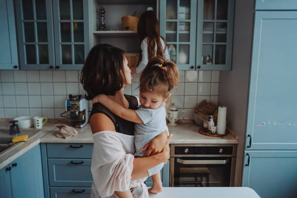 istock Happy family having fun in the kitchen 1018417454