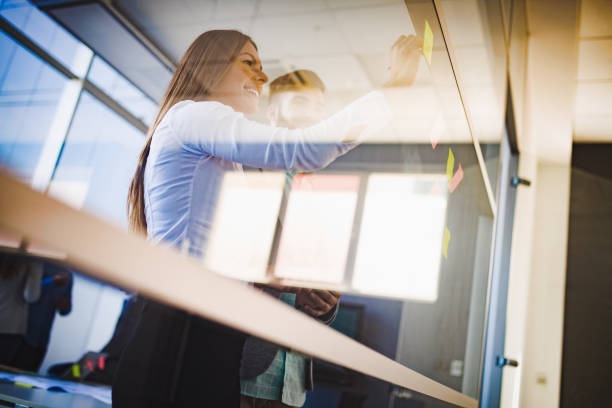 istock Business people planning strategy in office together 1018424698