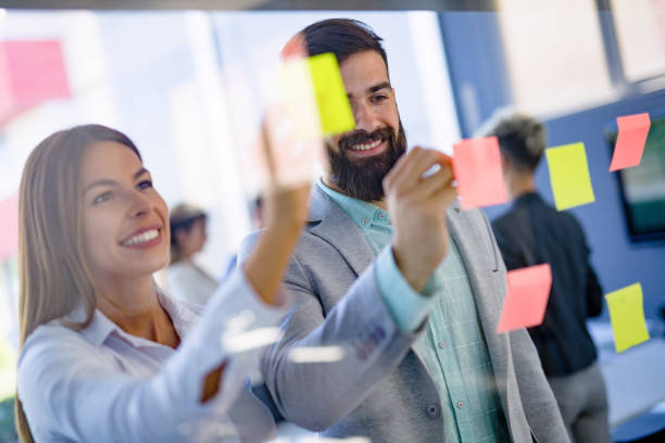 istock Business people planning strategy in office together 1018425454