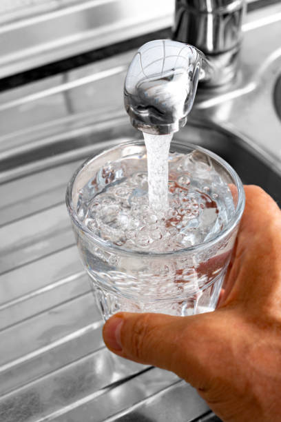 istock Fill in drinking water in a glass 1018430118