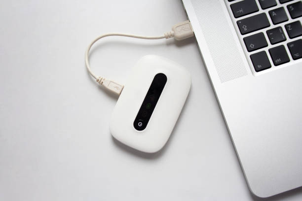 White mobile WiFi connected to laptop