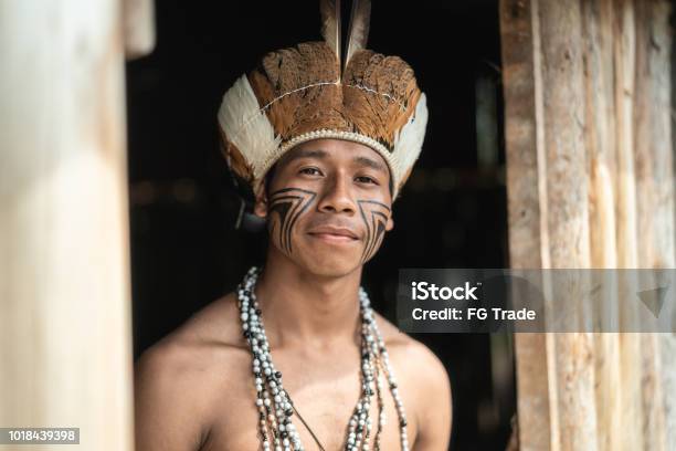 Indigenous Brazilian Young Man Portrait From Guarani Ethnicity At Home Stock Photo - Download Image Now