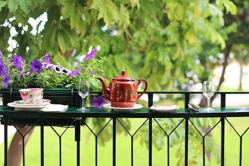 tea pot and cups on balcony