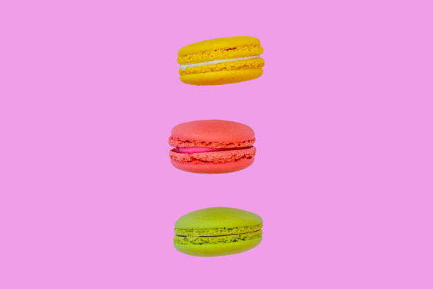 istock Tasty colorful macaroons on pink background 1018442020