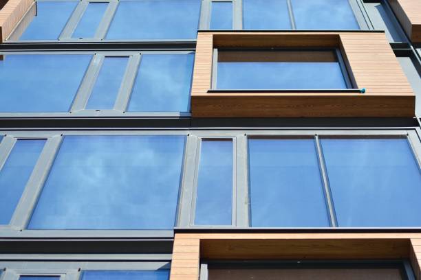 istock Blue clean glass wall of modern office building 1018442282