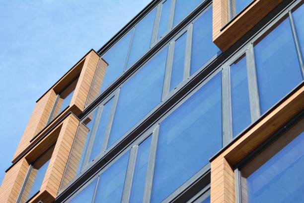 istock Blue clean glass wall of modern office building 1018442964