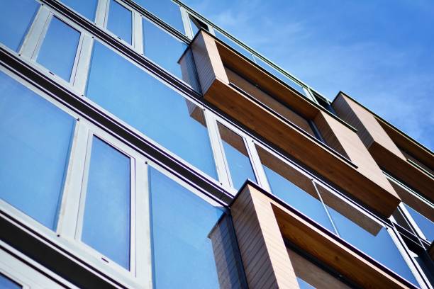 istock Blue clean glass wall of modern office building 1018445278
