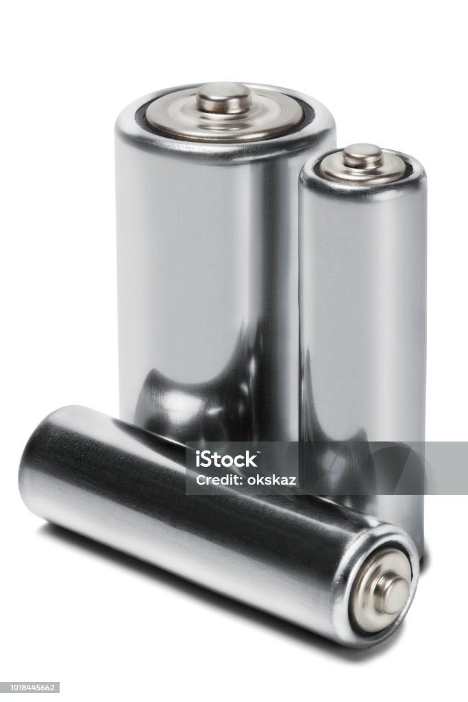 Three batteries AAA, AA and PP3 on white isolated background. Concept of renewable energy and sources of electrical power. Pattern for designer of environmental power sources, electrical power sources. Alcoholics Anonymous Stock Photo