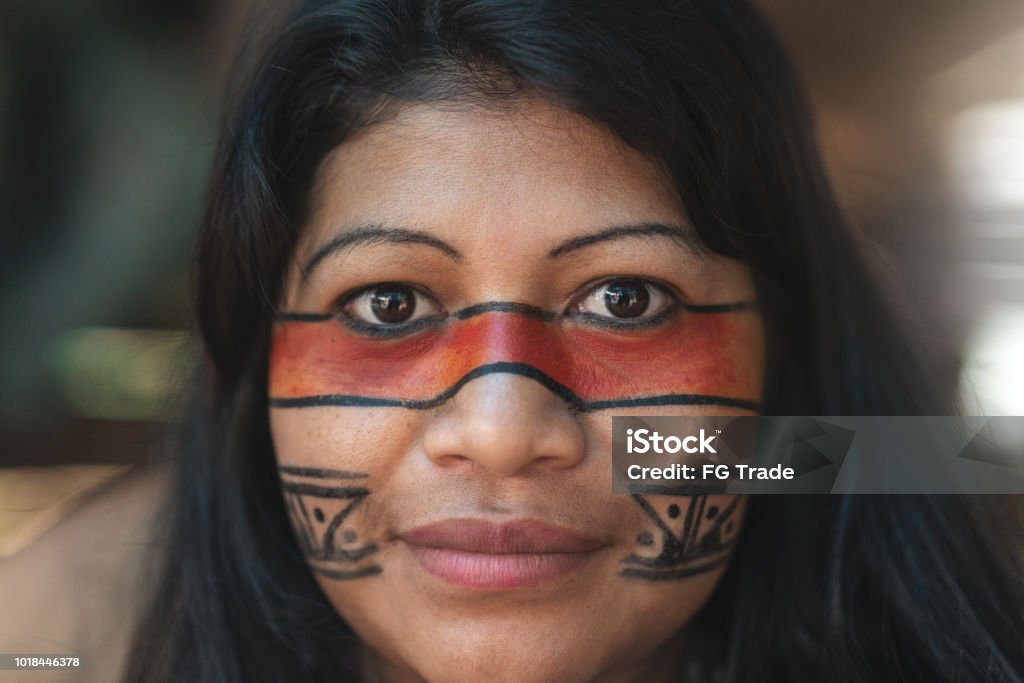 Indigenous Brazilian Young Woman Portrait, from Guarani Ethnicity, in a Hut - Closeup Beautiful shooting of how Brazilian Natives lives in Brazil Indigenous Culture Stock Photo