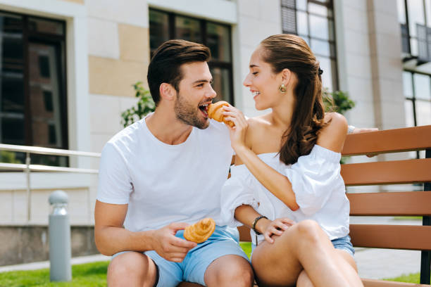 istock Delighted positive woman feeding her husband 1018451030