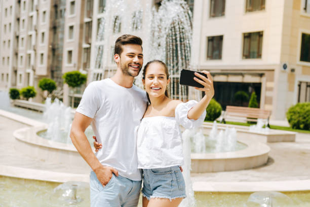 istock Happy nice woman holding her smartphone 1018455482