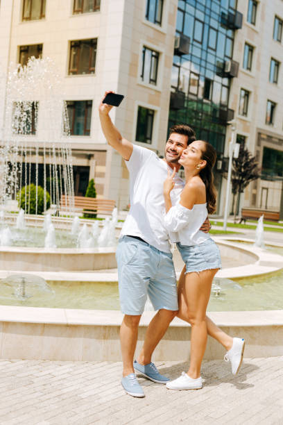 Delighted nice couple taking photos