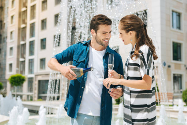 istock Nice positive man looking at her girlfriend 1018458654