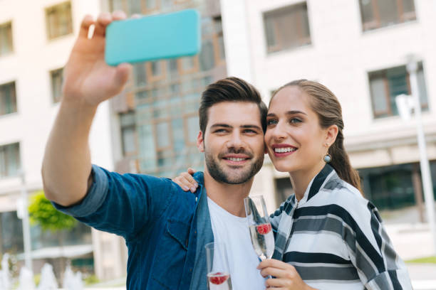 istock Nice positive couple standing together 1018459024