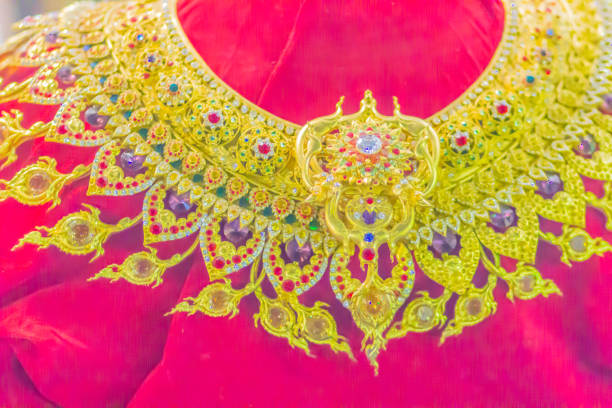 istock Beautiful Thai style golden necklace with multi colored gem stones. 1018477710