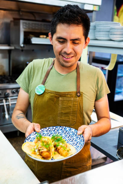 istock Mexican chef working in an authentic Mexican restaurant 1018477908
