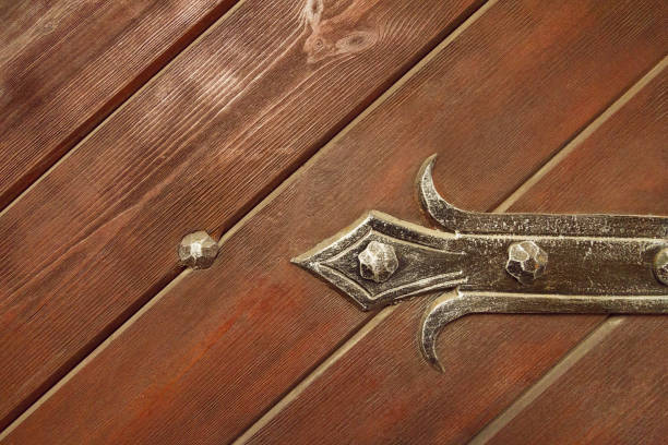 istock wooden door with forged elements 1018482290