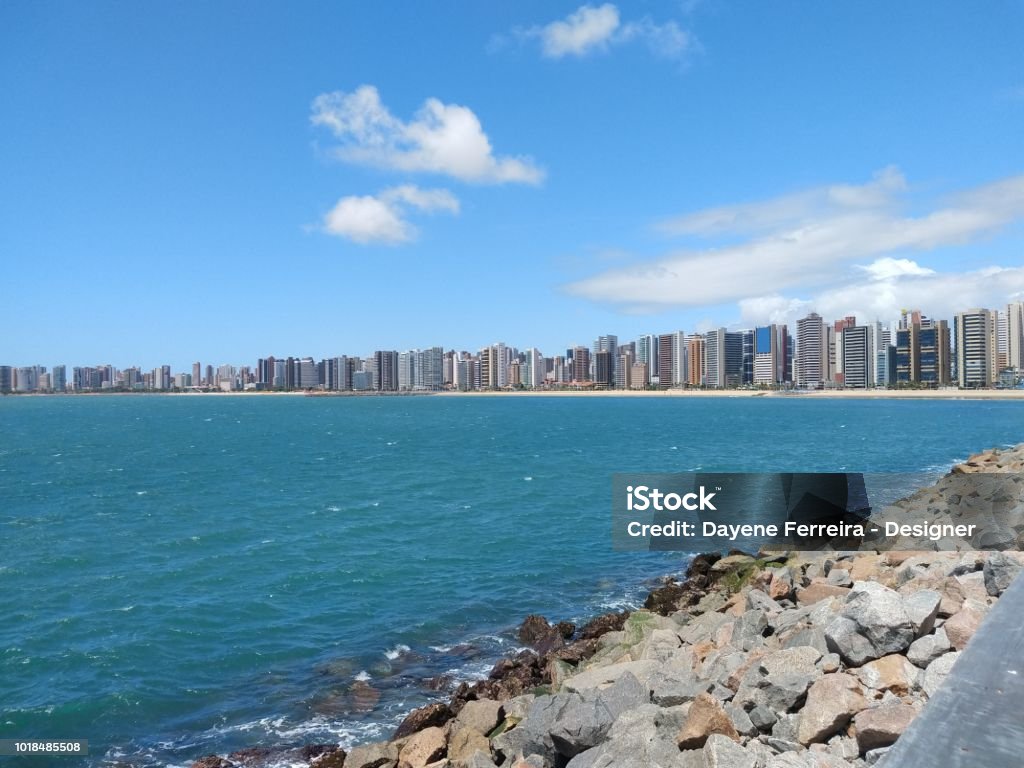 Iracema beach in Fortaleza CE Brazil crystal-clear beach with rocks and buildings all around Fortaleza - Ceará State Stock Photo