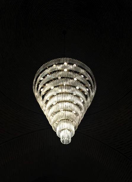 istock Big crystal chandelier and its light. 1018491872
