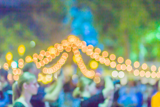 istock Abstract blurred circular bokeh background. Defocused background with bokeh of LED light decoration during Christmas and new year festival. 1018496208