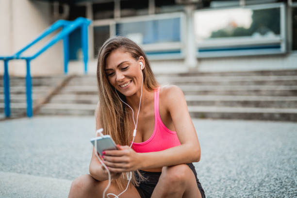 istock Young woman taking a break and using her smartphone 1018502890