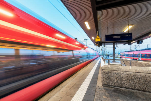 istock High speed train in motion on the railway station at sunset. Moving blurred modern intercity train on the railway platform in Europe. Passenger railway transportation. Railroad at twilight. Travel 1018505598