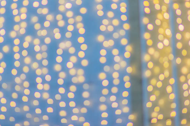 istock Abstract blurred circular bokeh background. Defocused background with bokeh of LED light decoration during Christmas and new year festival. 1018508316