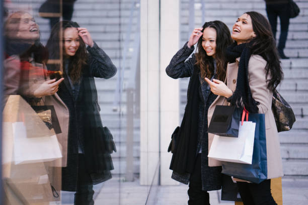 istock Female friends winter shopping 1018511816