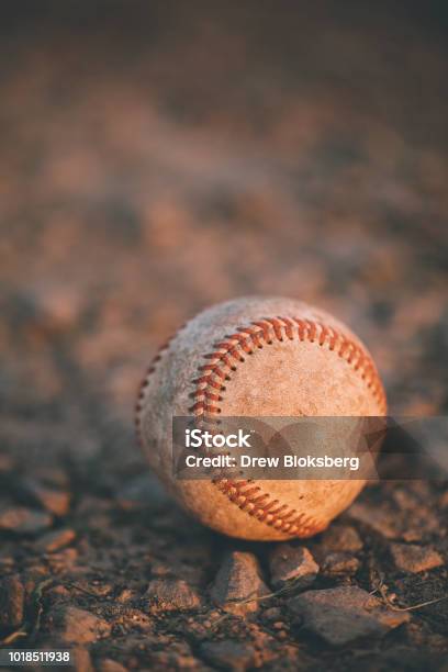 Baseball In The Sunset Stock Photo - Download Image Now - Baseball - Ball, Baseball - Sport, Brown