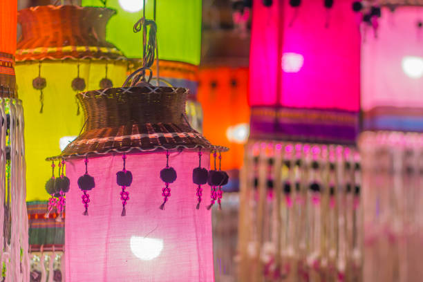 Colorful patterned on ceiling lantern with fabric in northeastern Thai style.
