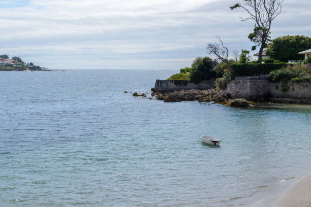 istock boat on the water, view from the beach 1018521722