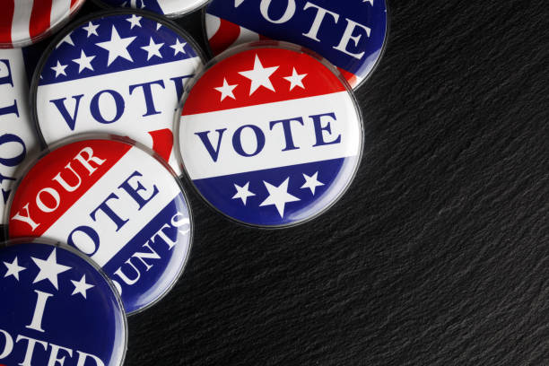 istock Red, white, and blue vote buttons background 1018521766
