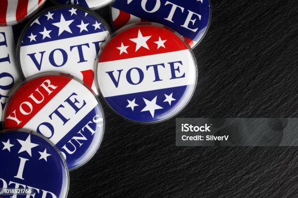 Red White And Blue Vote Buttons Background Stock Photo - Download Image Now - Voting, Election, Campaign Button