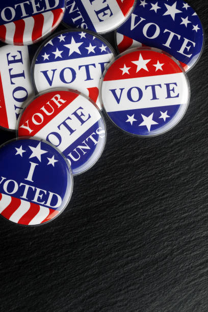 istock Red, white, and blue vote buttons background 1018521790