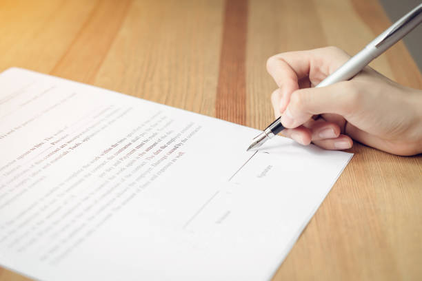 istock closeup of signing a documentation agreement and pen on the table. 1018522326