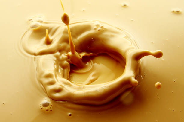 istock Milk and coffee splash as background 1018524602