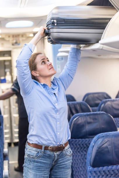 istock Mature woman at the airplane 1018527316