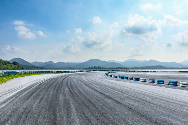 istock Asphalt square and mountain with lake on a sunny day 1018527490