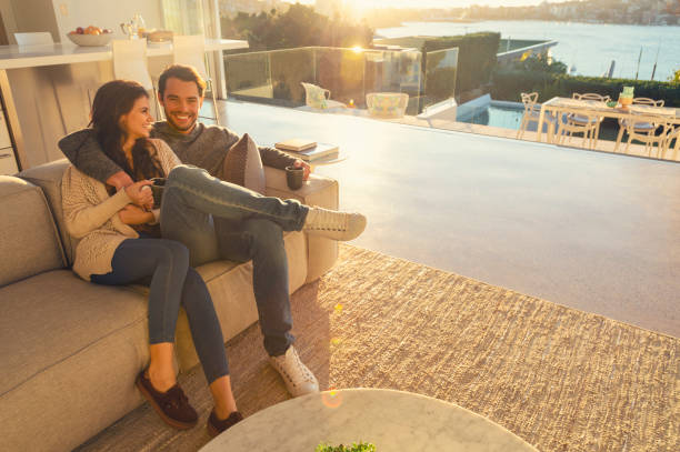 istock Couple on the sofa at sunrise. 1018527780