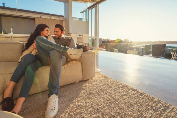 istock Couple on the sofa at sunrise. 1018528134