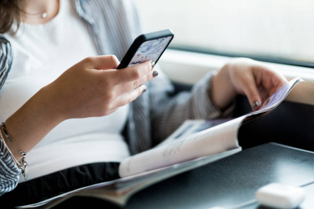 Young Girl Using Her Phone On The Train