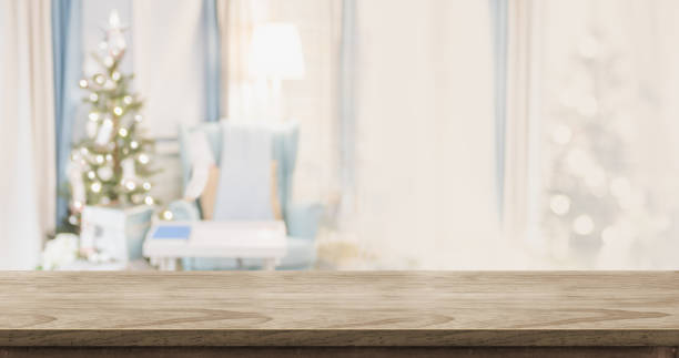 istock Empty wood table top with abstract warm living room decor with christmas tree blur background with bokeh light,Holiday backdrop,Mock up banner for display of advertise product ,luxury house. 1018565616