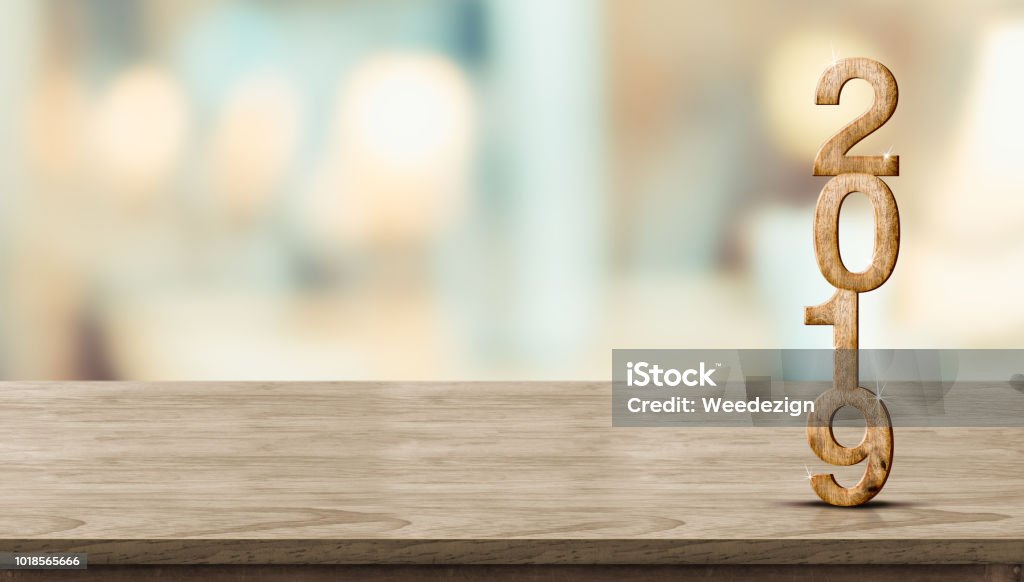 New year 2019 wood number (3d rendering) on wooden table at blur abstract bokeh light background,Mock up banner space for display or montage of product,holiday celebration greeting card. New year 2019 wood number (3d rendering) on wooden table at blur abstract bokeh light background,Mock up banner space for display or montage of product,holiday celebration greeting card 2019 Stock Photo