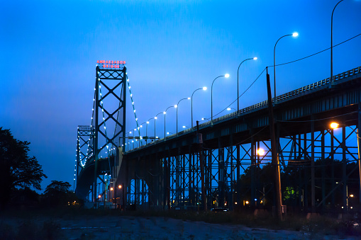 The Ambassador Bridge links Detroit, Michigan, USA with Windsor, Ontario, Canada.   It is one of the busiest land trade routes in North America.   This photo is taken from the Windsor side of the bridge, facing north towards Detroit.
