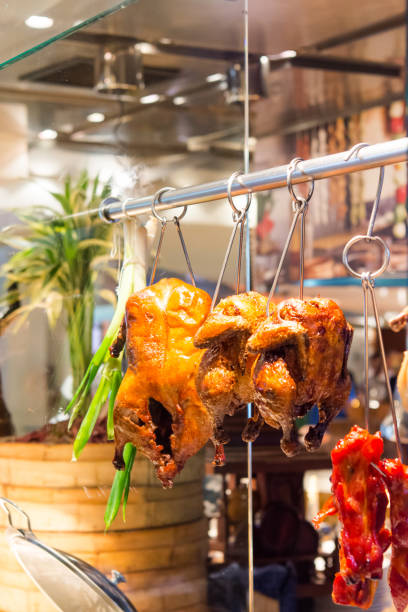istock hanged roast chicken and duck 1018583348