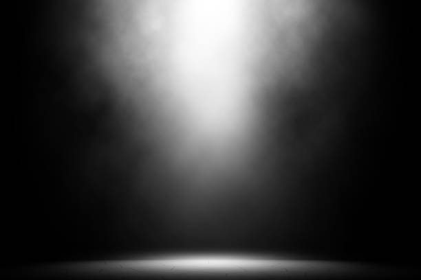 istock White spotlight smoke on tile floor brick background. 1018591420