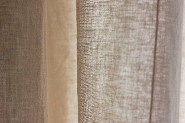 istock The texture of natural linen fabric beige curtains background 1018599344